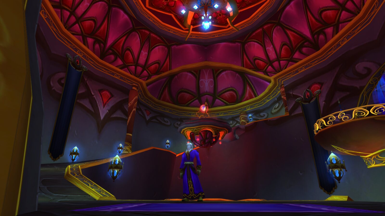Thrïïr stands in Silvermoon’s translocation chamber beneath red and gold arches